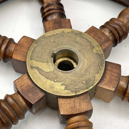 81 - A teak and brass yacht or ship's wheel, mid 20th century, with six turned spokes, diameter 51cm.