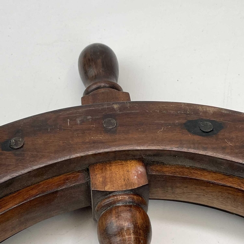 81 - A teak and brass yacht or ship's wheel, mid 20th century, with six turned spokes, diameter 51cm.