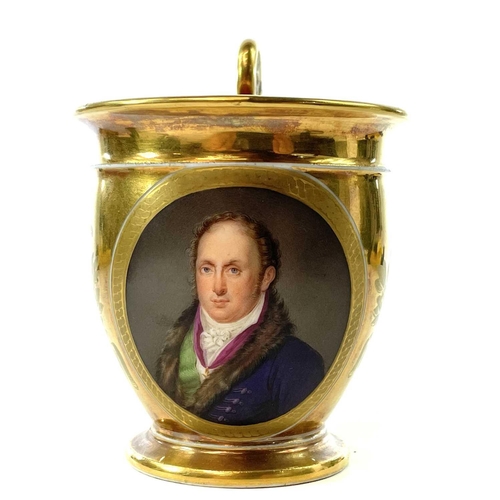 811 - A French Paris porcelain gilt portrait cup and saucer, circa 1830, decorated in the Feuillet worksho... 