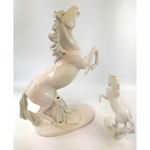 817 - An Italian pottery lamp base, modelled in the white as a rearing horse, lacks all fittings, height 5... 