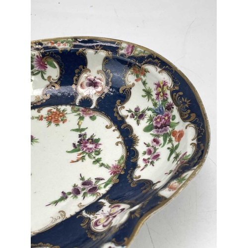 825 - A pair of Worcester blue scale porcelain dishes, circa 1775, of kidney shape, with flower painted de... 