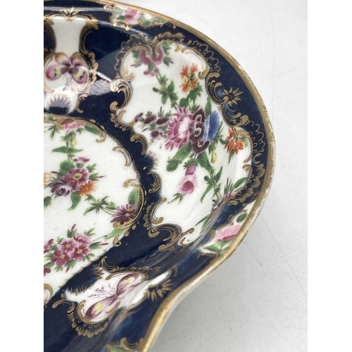 825 - A pair of Worcester blue scale porcelain dishes, circa 1775, of kidney shape, with flower painted de... 