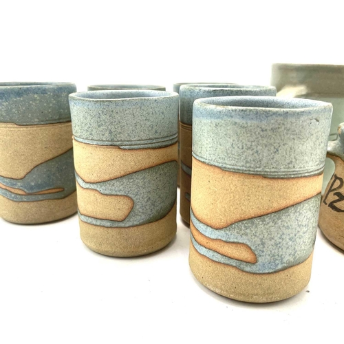 835 - Alan Brough, A set of six cylindrical beakers, with speckled blue decoration, impressed seal marks, ... 