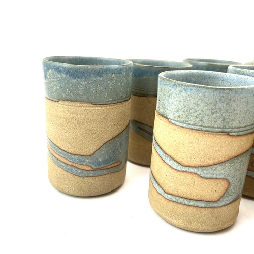 835 - Alan Brough, A set of six cylindrical beakers, with speckled blue decoration, impressed seal marks, ... 