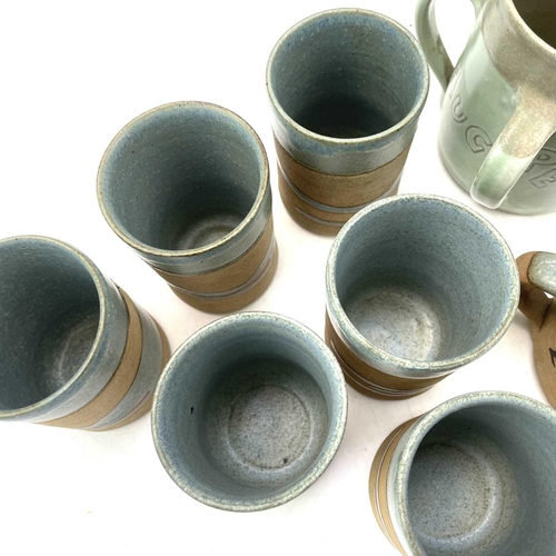 835 - Alan Brough, A set of six cylindrical beakers, with speckled blue decoration, impressed seal marks, ... 