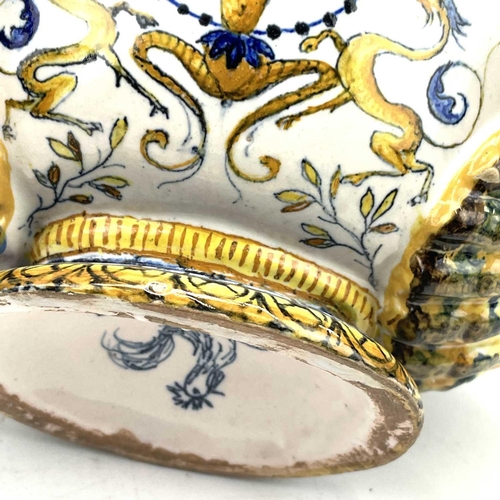 838 - A late 19th century Cantagalli maiolica bowl and cover with eros on a dolphin and twin shell handles... 