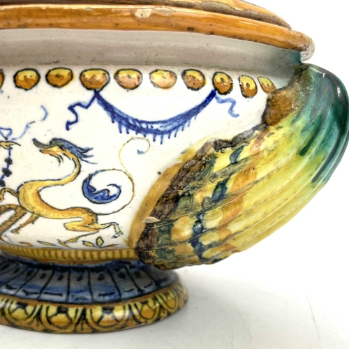 838 - A late 19th century Cantagalli maiolica bowl and cover with eros on a dolphin and twin shell handles... 