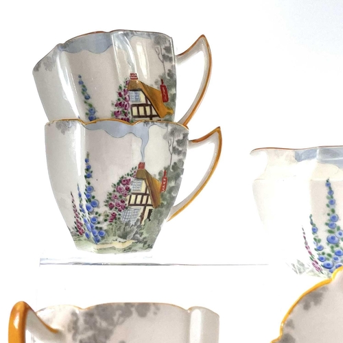 852 - A Shelley Queen Anne shape coffee service, decorated a cottage garden pattern, comprising a coffee p... 