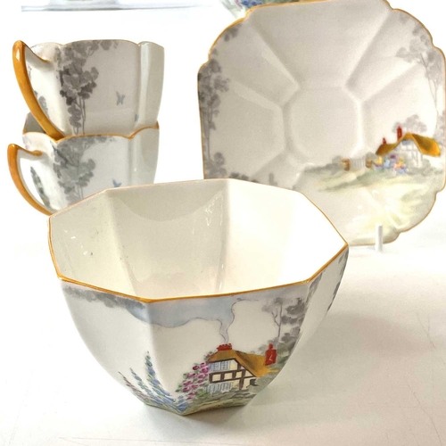 852 - A Shelley Queen Anne shape coffee service, decorated a cottage garden pattern, comprising a coffee p... 