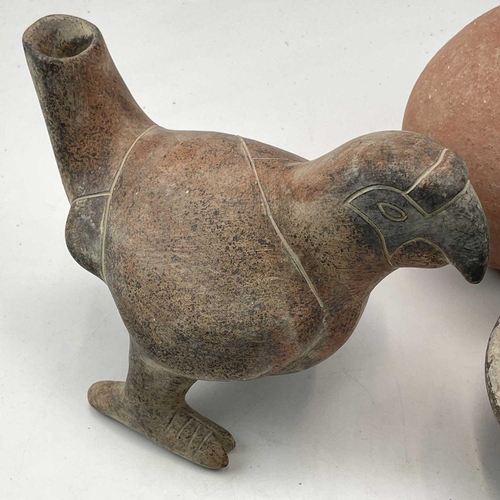 870 - A Pre Columbian style pottery jug in the form of a parrot height 16cm together with two pottery jugs... 