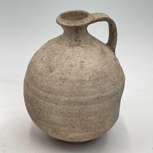 870 - A Pre Columbian style pottery jug in the form of a parrot height 16cm together with two pottery jugs... 