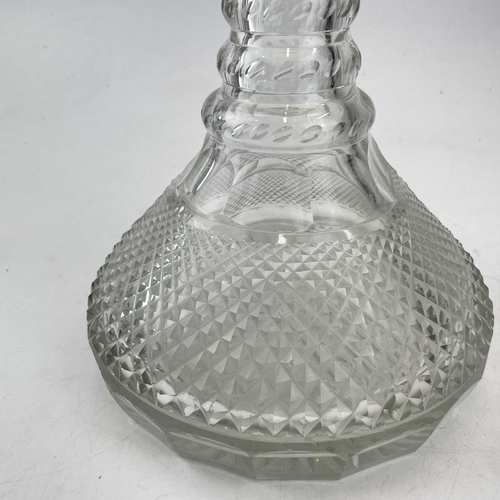 876 - A 19th century cut glass ship's decanter and stopper with quadruple ring neck, height 25cm.