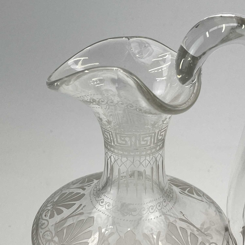 891 - A Victorian etched glass Champagne ewer, with Greek key and anthemion borders and decorated trailing... 