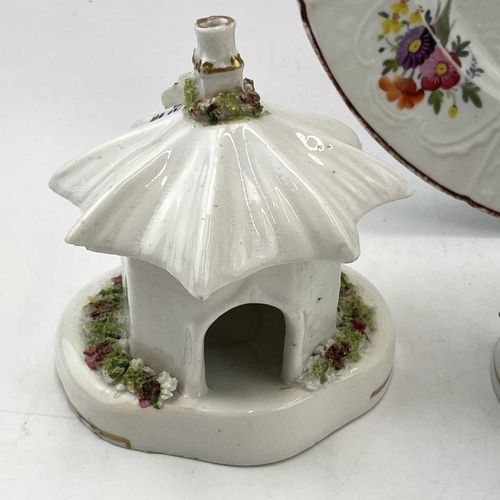 896 - An early Victorian Staffordshire porcellaneous pastille burner, modelled as a cottage, height 12cm, ... 