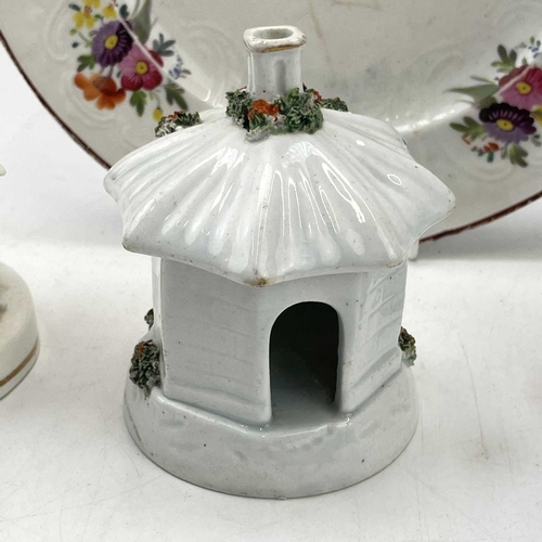 896 - An early Victorian Staffordshire porcellaneous pastille burner, modelled as a cottage, height 12cm, ... 