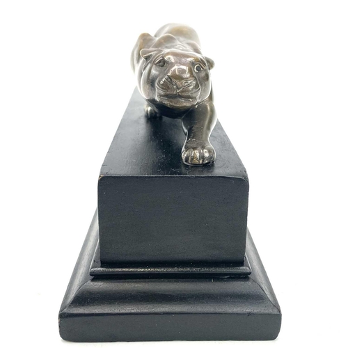 9 - An Art Deco bronze model of a prowling panther, with remnants of plated finish, on an ebonised base,... 