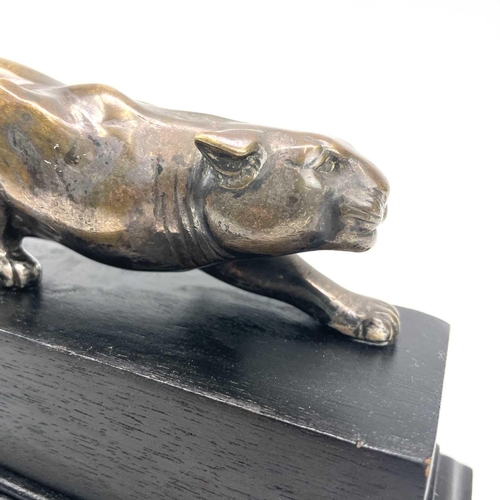 9 - An Art Deco bronze model of a prowling panther, with remnants of plated finish, on an ebonised base,... 