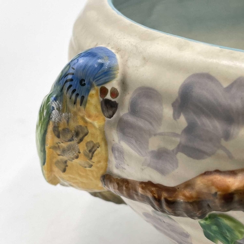 907 - A Clarice Cliff bowl, moulded with two parrots on a branch, diameter 24cm.One parrot with a chipped ... 