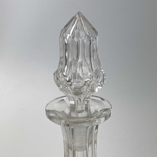 909 - A 19th century cut glass decanter with a later stopper height 25cm together with another two glass d... 