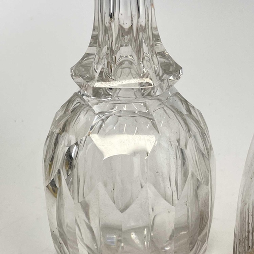 909 - A 19th century cut glass decanter with a later stopper height 25cm together with another two glass d... 