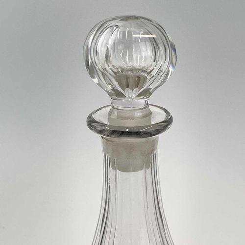 909 - A 19th century cut glass decanter with a later stopper height 25cm together with another two glass d... 