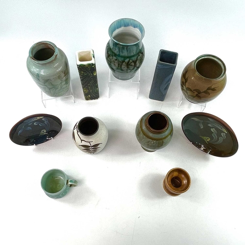 911 - A collection of Lamorna pottery, comprising two square section vases, five other vases, and other pi... 