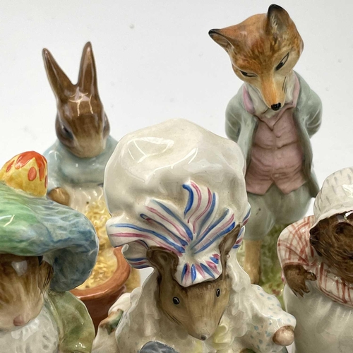 916 - A Beswick Beatrix potter figure of Peter Rabbit, height 11.5cm together with seventeen other Beswick... 