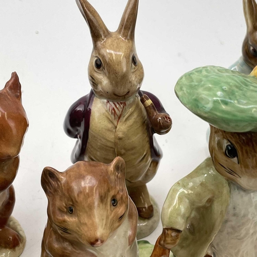 916 - A Beswick Beatrix potter figure of Peter Rabbit, height 11.5cm together with seventeen other Beswick... 