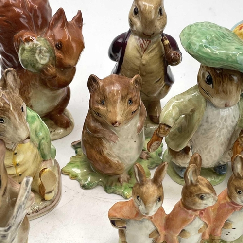 916 - A Beswick Beatrix potter figure of Peter Rabbit, height 11.5cm together with seventeen other Beswick... 