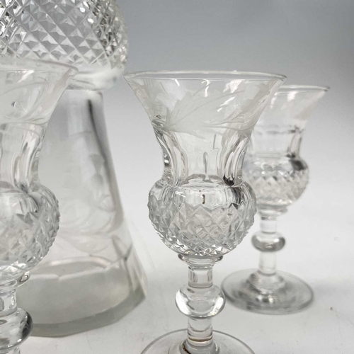 920 - An Edinburgh crystal cut glass tot set, comprising a handled decanter, the stopper incorporating a t... 