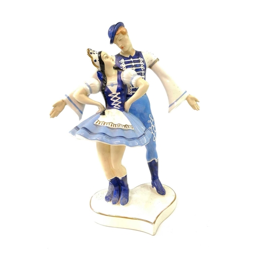 924 - A Royal Dux porcelain figure group dressed in traditional Russian costume, height 35cm together with... 