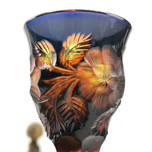 926 - An unusual vari-coloured liqueur glass, possibly Moser, early 20th century, deeply engraved with flo... 