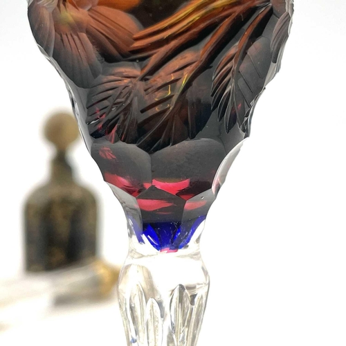 926 - An unusual vari-coloured liqueur glass, possibly Moser, early 20th century, deeply engraved with flo... 