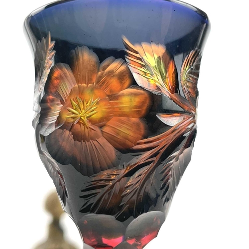 926 - An unusual vari-coloured liqueur glass, possibly Moser, early 20th century, deeply engraved with flo... 