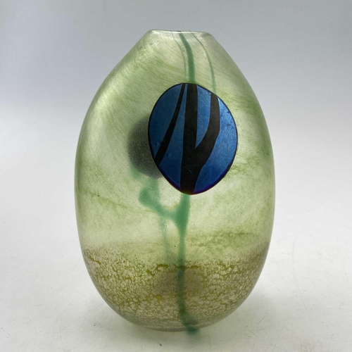 931 - A Norman Stuart Clarke art glass vase, with two iridescent blue roundels on a mottled green ground, ... 