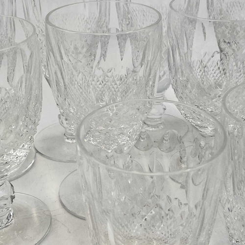 933 - A set of four Waterford crystal champagne flutes, height 15.5cm together wither four Waterford cryst... 