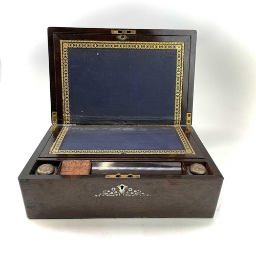 95 - A Victorian rosewood and mother of pearl inlaid writing box, with fitted interior including two inkw... 