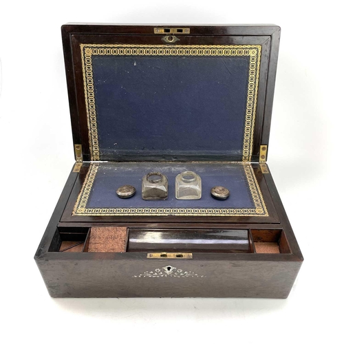 95 - A Victorian rosewood and mother of pearl inlaid writing box, with fitted interior including two inkw... 