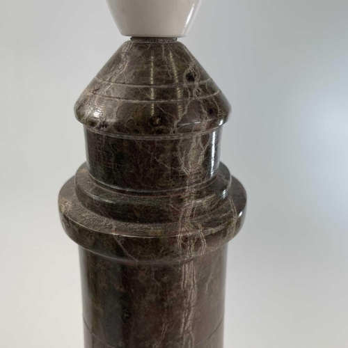 97 - A Cornish serpentine turned and polished lighthouse table lamp on a rock base, height 38cm.