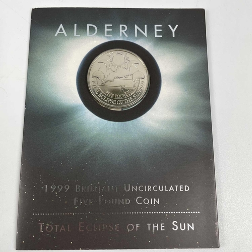 124 - Alderney Royal Mint Uncirculated £5 Coins (x8). Comprising: 1: 1999 Total Eclipse of the Sun. 2: 200... 