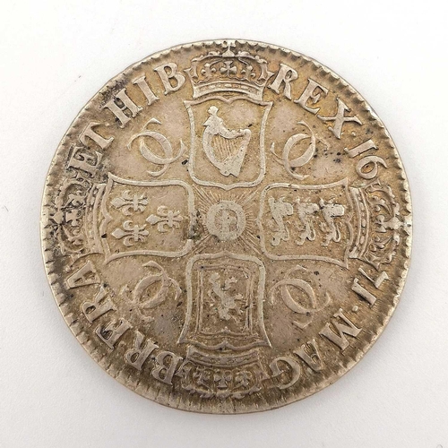 170 - Great Britain Silver Crown Charles II. A cased 1671 silver Crown - higher grade with good details.