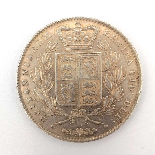 184 - Great Britain Silver Crown Q. Victoria. A cased 1844 star stops on Regni Vlll edged silver crown. On... 