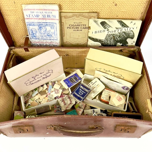 412 - World Stamps. Accumulation in brown suitcase - misc. sorted into boxes, envelopes and in albums - no... 