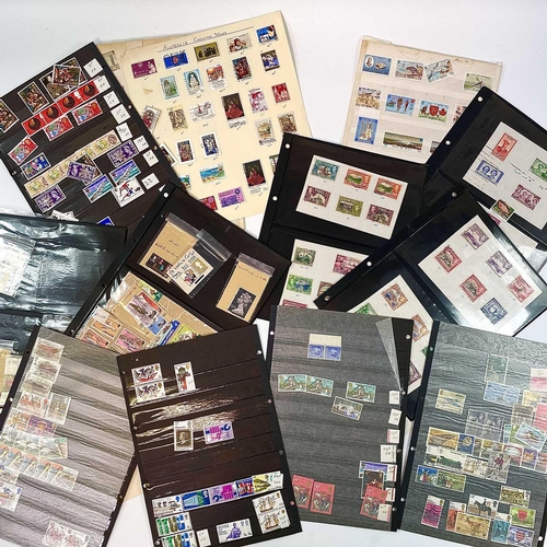 487 - Great Britain & World Stamps. A large box containing various stamps on leaves, in albums, in club bo... 