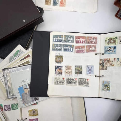 501 - World stamp albums and GB first day cover albums. A large box containing a world collection in four ... 