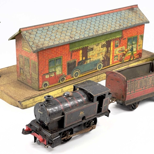 642 - Hornby 0 Gauge Clockwork Railway Tinplate Items Comprising two engines, twelve carriages, and wagons... 