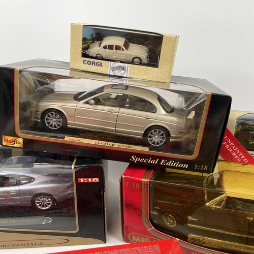 701 - Die Cast Model Vehicles (x12). Box containing boxed: 1: Maisto (x2) 1/18 scale Aston Martin DB7, Jag... 