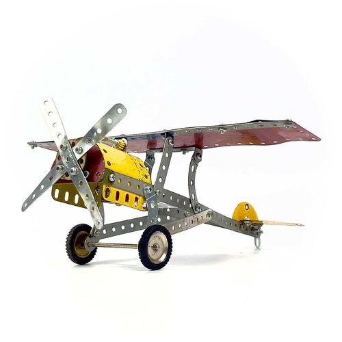 711 - Meccano - Motor Car and Aeroplane Models (x4). Comprising 2 made up model cars plus 2 made up model ... 