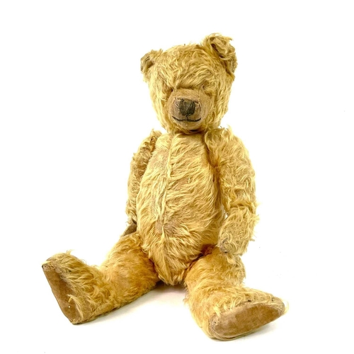 736 - Early to Mid 20th Century Teddy Bear Comprising an articulated plush golden coloured bear (length 42... 