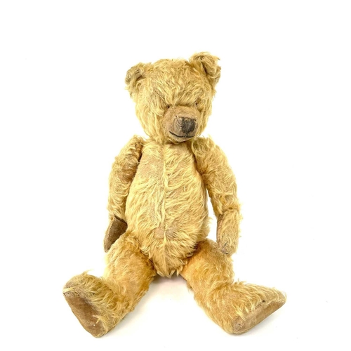 736 - Early to Mid 20th Century Teddy Bear Comprising an articulated plush golden coloured bear (length 42... 